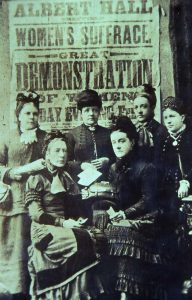 It is believed, but is not certain, that Alice Cliff Scatcherd is amongst this group of suffragettes. Photograph not placed on the Leodis website.DKA text: During the 1870s, 1880s and 1890s, Alice Cliff Scatcherd was one of the great pioneers of the Women's Suffrage Movement, writing many letters to the press and helping to organise numerous demonstrations in many big cities to bring forward the need for women to have the vote. She is on the photograph of six of their members who were attending a demonstration at the Albert Hall in London. It is not certain which is Alice Cliff Scatcherd but, possibly she is the one seated on the right at the front.