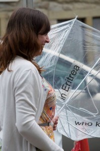 smiling with umbrella